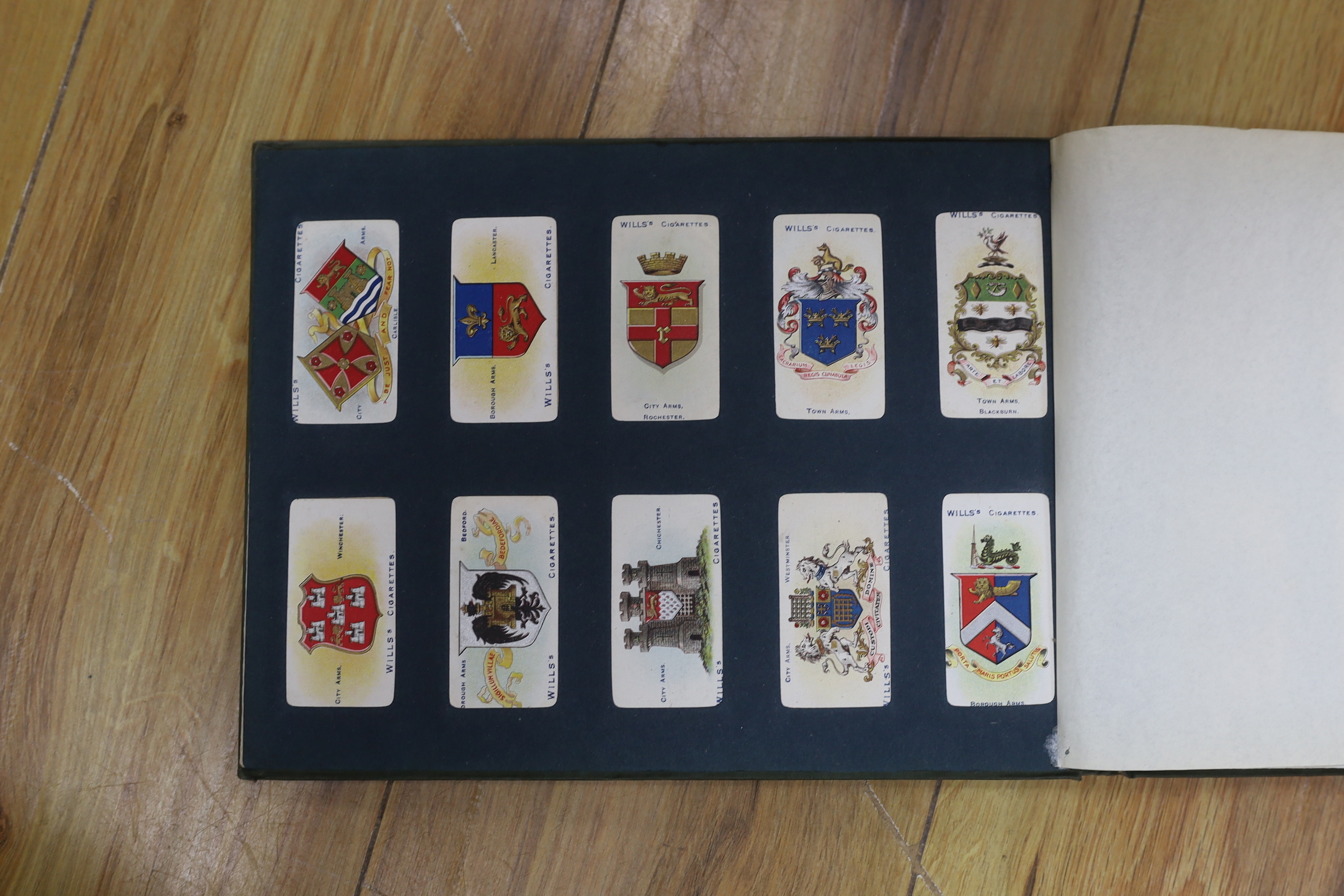 A collection of cigarette cards in albums